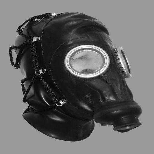 A black rubber gas mask with a large circular clear viewing lens, side filter canister, and adjustable straps, shown against a plain light background.