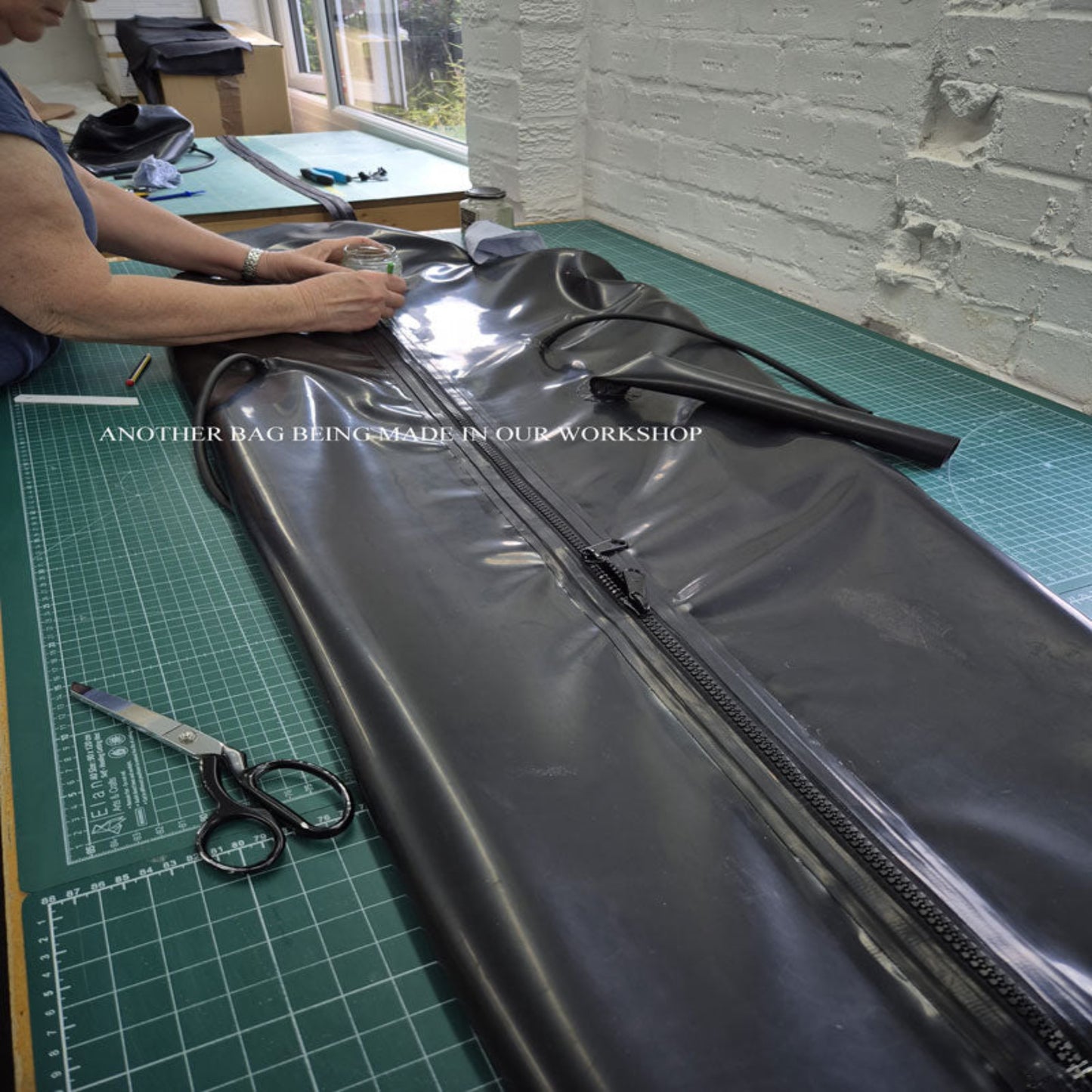 Handmade inflatable latex sleep bag being crafted in UK workshop