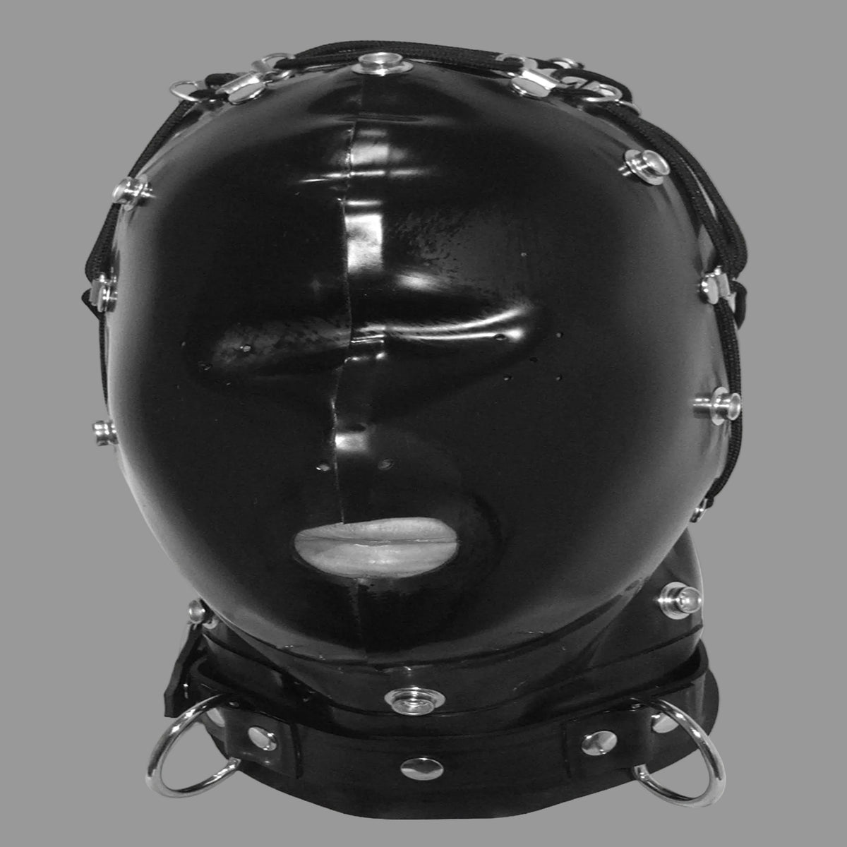A glossy black latex hooded mask with silver metal studs, rings, and straps, shown against a plain off-white background.
