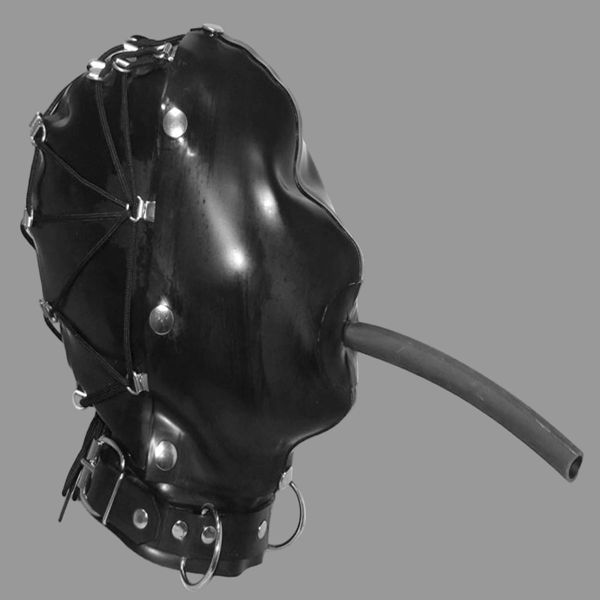 Black LATEX hood with metal studs, straps, and a protruding tube, shown against a plain light background.